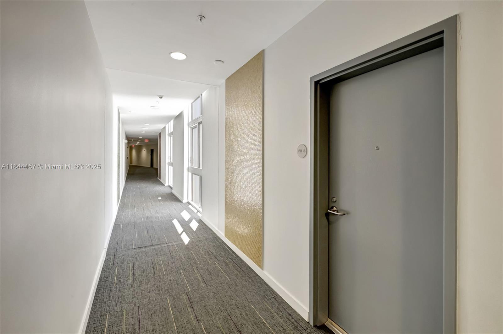 2001 Meridian Avenue, Unit PH15 Miami Beach, FL 33139 - Photo 19 of 31 a view of a hallway with wooden floor