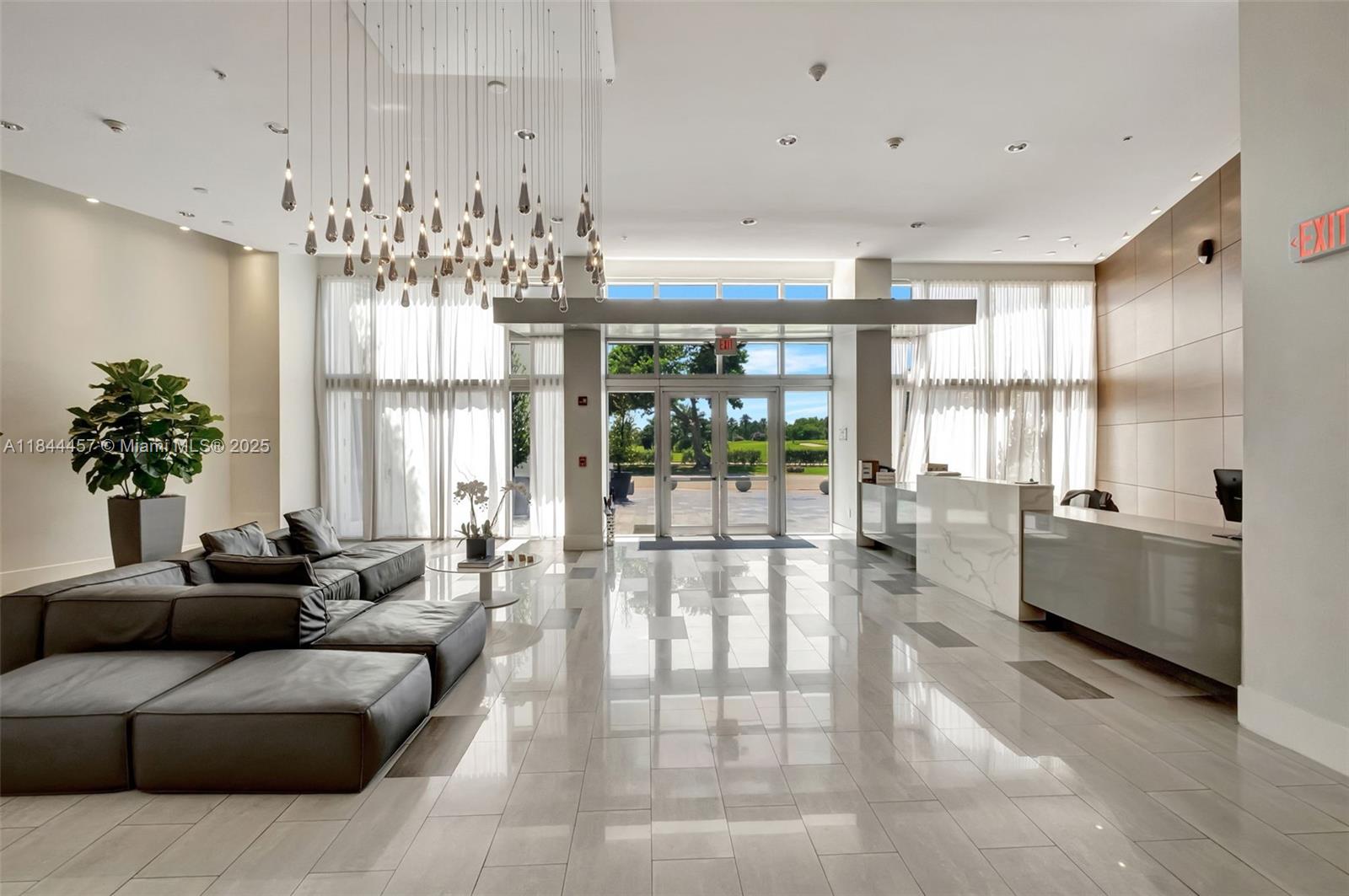 2001 Meridian Avenue, Unit PH15 Miami Beach, FL 33139 - Photo 23 of 31 a living room with furniture and a large window