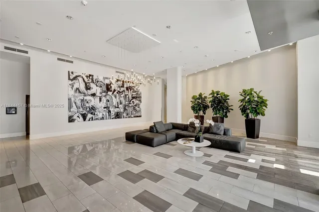 a living room with furniture potted plant and a rug