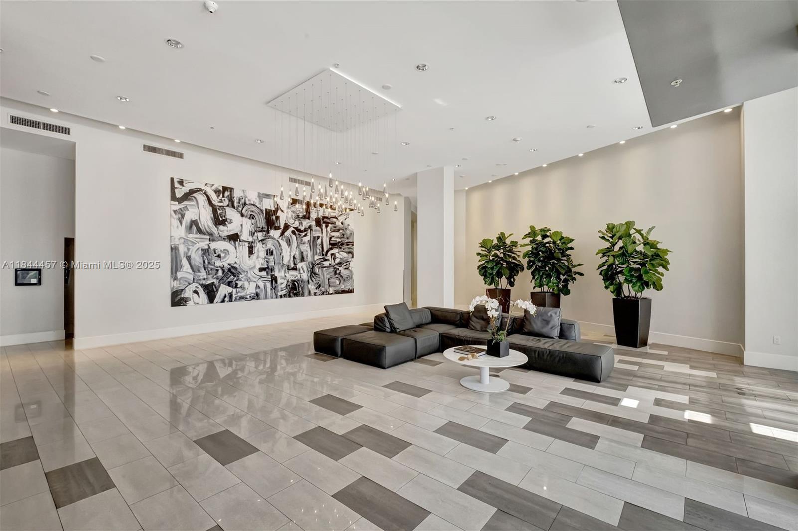2001 Meridian Avenue, Unit PH15 Miami Beach, FL 33139 - Photo 24 of 31 a living room with furniture potted plant and a rug