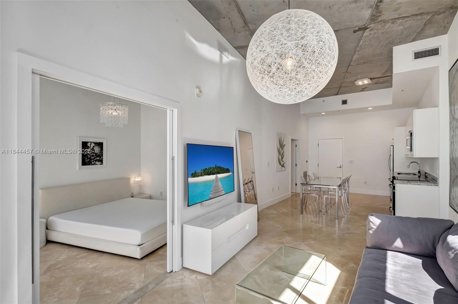 2001 Meridian Avenue, Unit PH15 Miami Beach, FL 33139 - Photo 4 of 31 a living room with furniture and a table