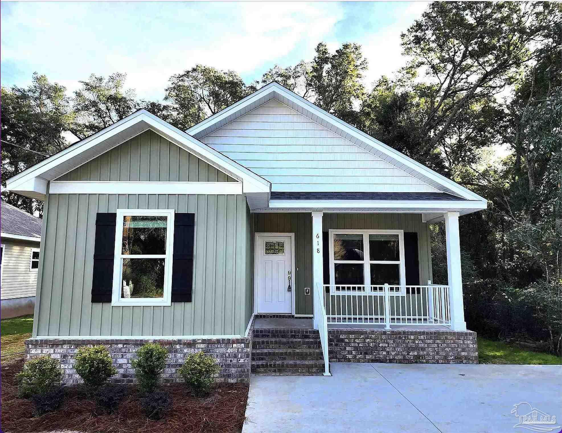 618 Rentz Avenue Pensacola, FL 32507 - Photo 1 of 20 a front view of a house with a yard