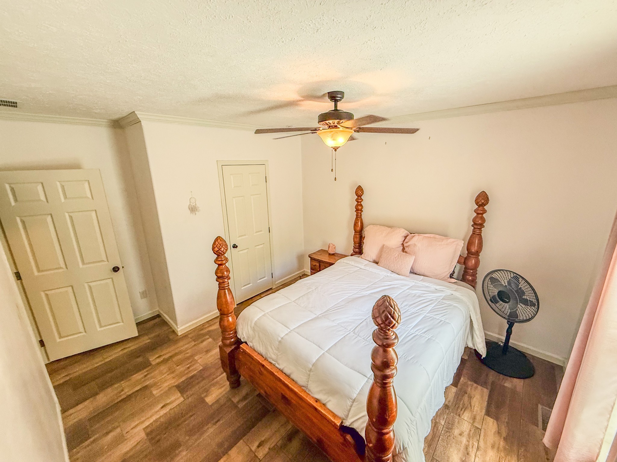 137 Hawkins Road Westmoreland, TN 37186 - Photo 45 of 71 a bedroom with a bed and a chandelier