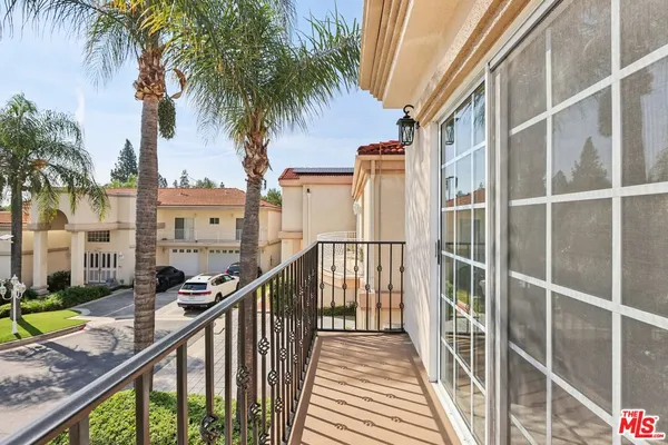 a view of a balcony with an outdoor space