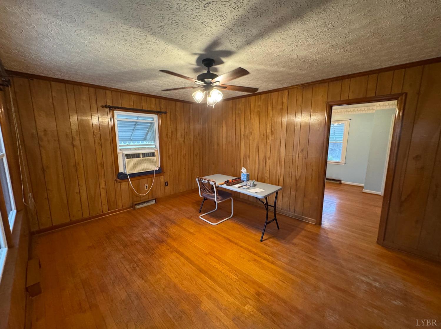 126 Rothwood Road Monroe, VA 24574 - Photo 3 of 21 a living room with furniture and a ceiling fan