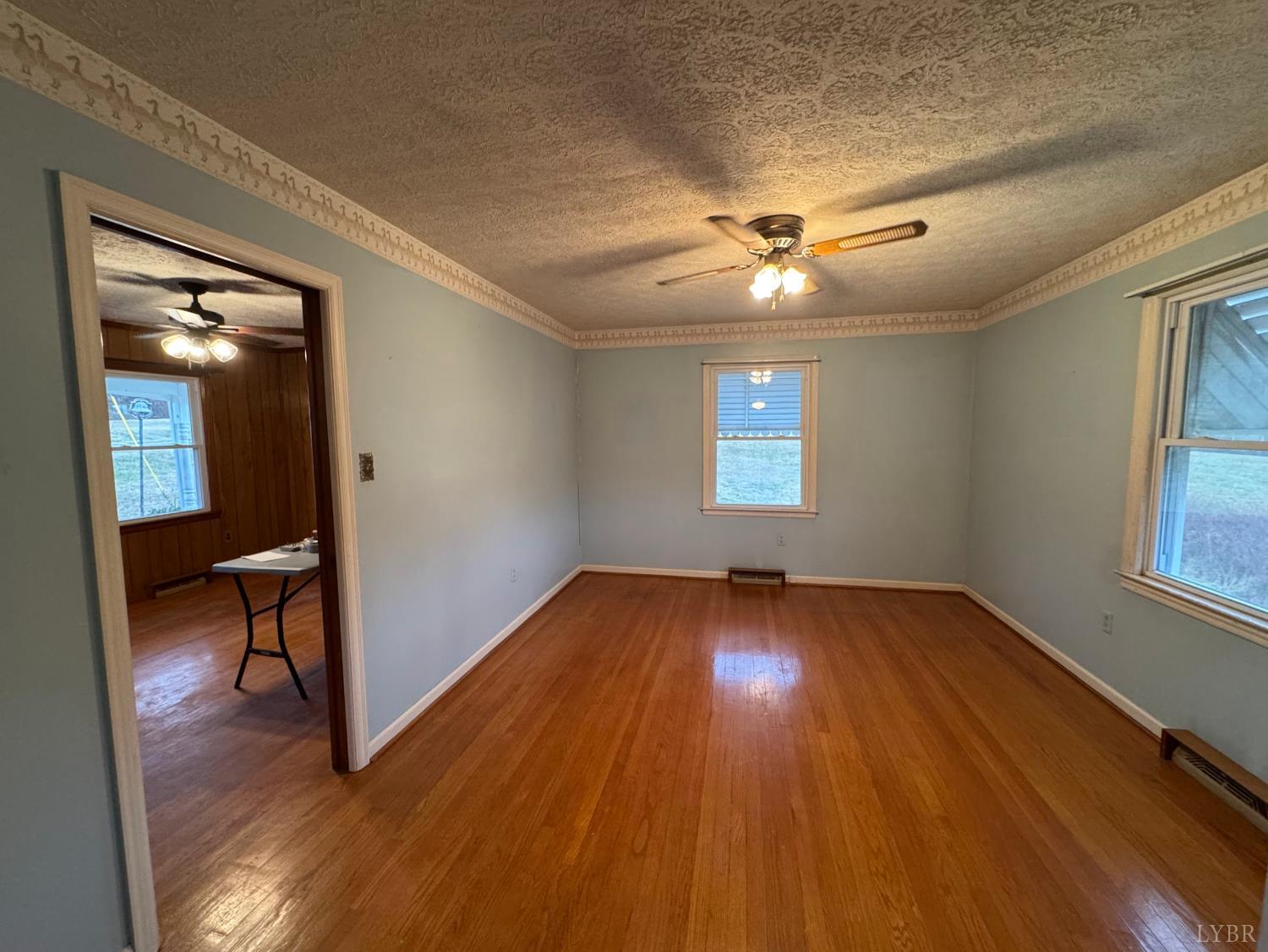 126 Rothwood Road Monroe, VA 24574 - Photo 8 of 21 wooden floor in an empty room with a window
