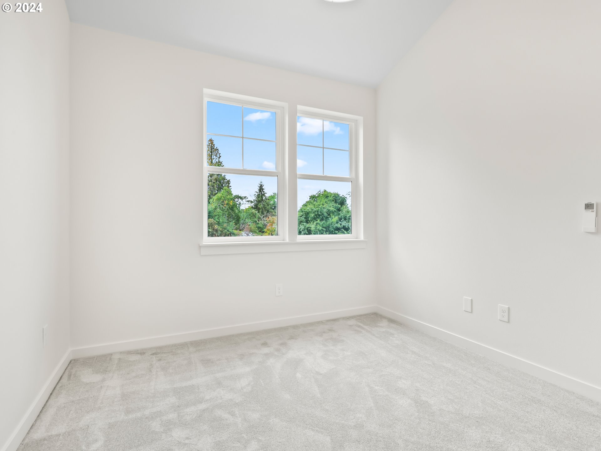 4636 Northeast Sumner Street Portland, OR 97218 - Photo 25 of 39 an empty room with a window
