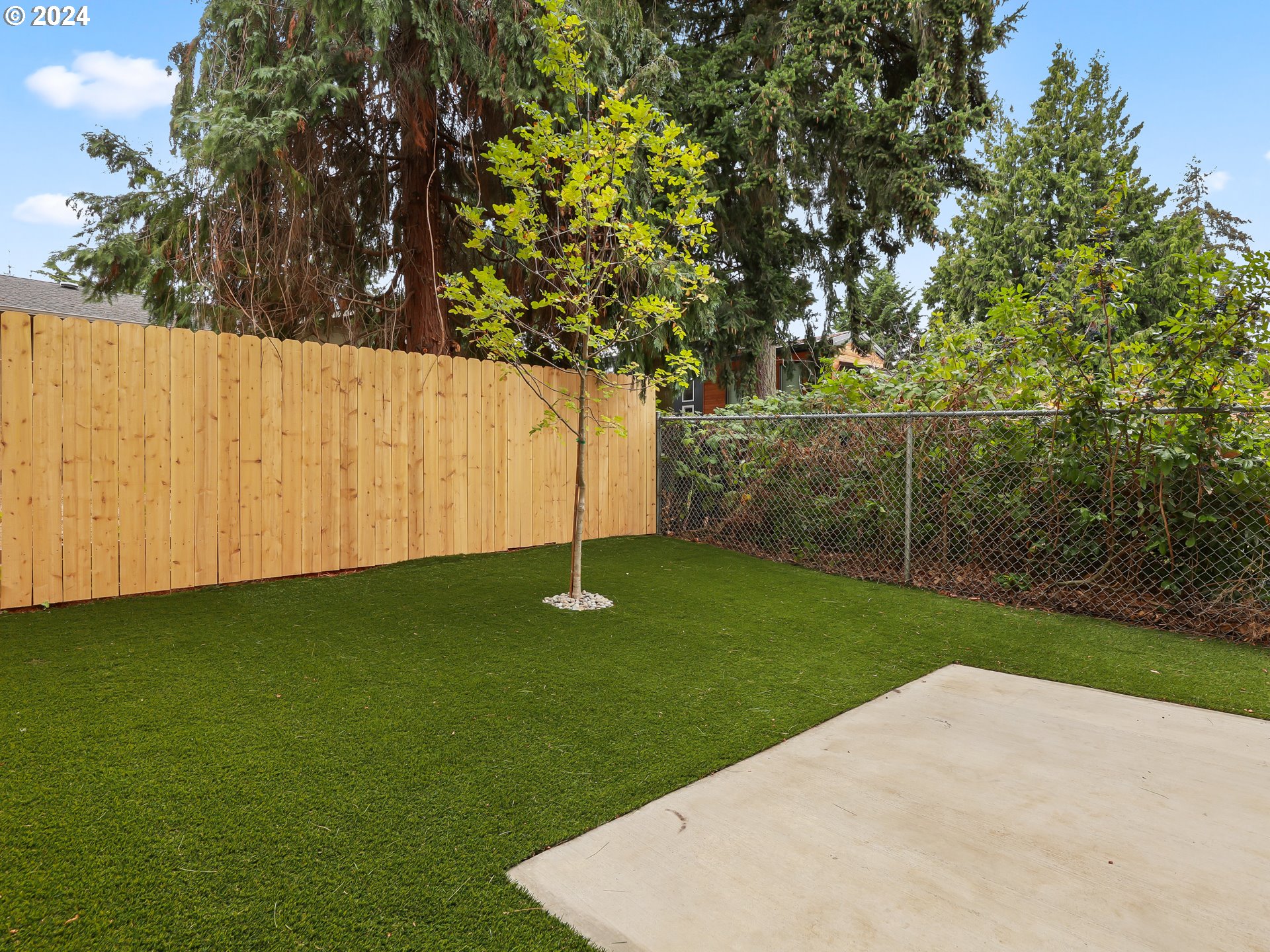 4636 Northeast Sumner Street Portland, OR 97218 - Photo 33 of 39 a view of a backyard with a small cabin