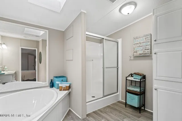 a hallway with cabinets and wooden floor
