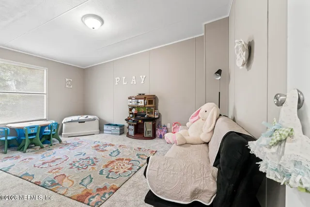 a bedroom with furniture and a chandelier