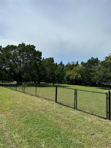 a view of outdoor space with deck and yard