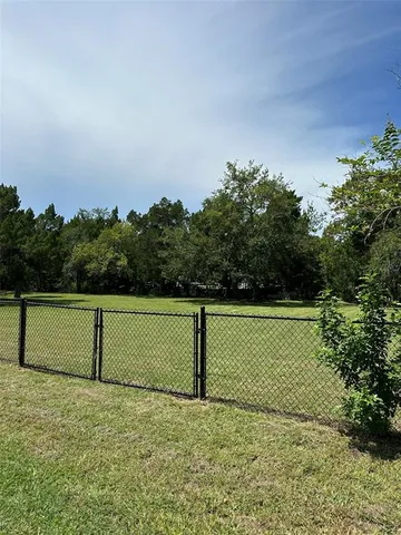a view of a field with an ocean