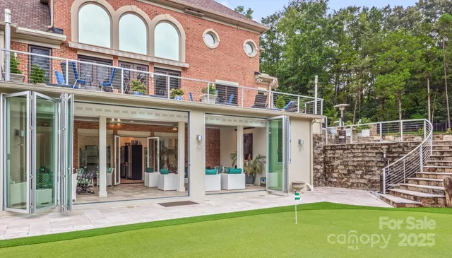 a front view of a building with a garden