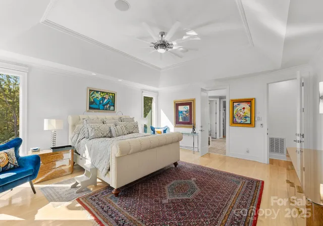 a living room with furniture and large windows