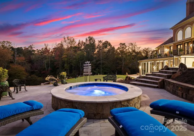 a view of a swimming pool with outdoor seating