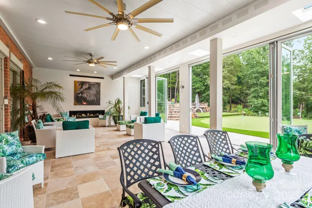 a bedroom with a bed a couch and a window