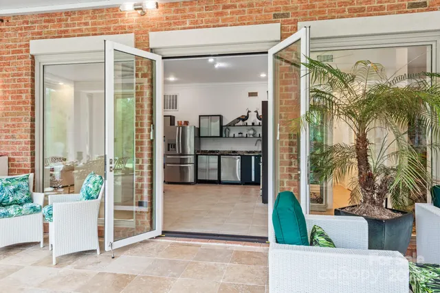 a bedroom with a bed a dresser and book shelf