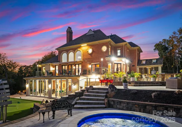 a view of a patio with table and chairs with wooden floor and fence