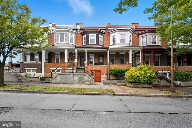 front view of a house with a small yard