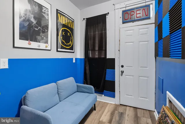 a view of a livingroom with furniture and wooden floor