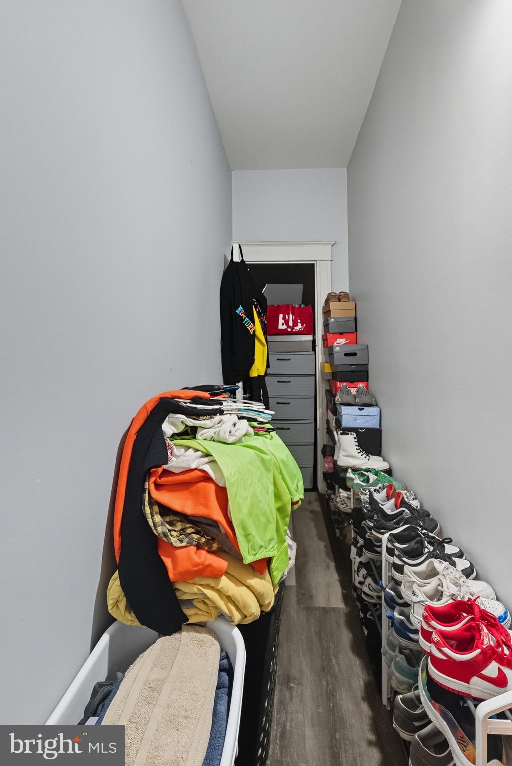 604 East 33rd Street Baltimore, MD 21218 - Photo 15 of 22 a bedroom with a bed and a chandelier