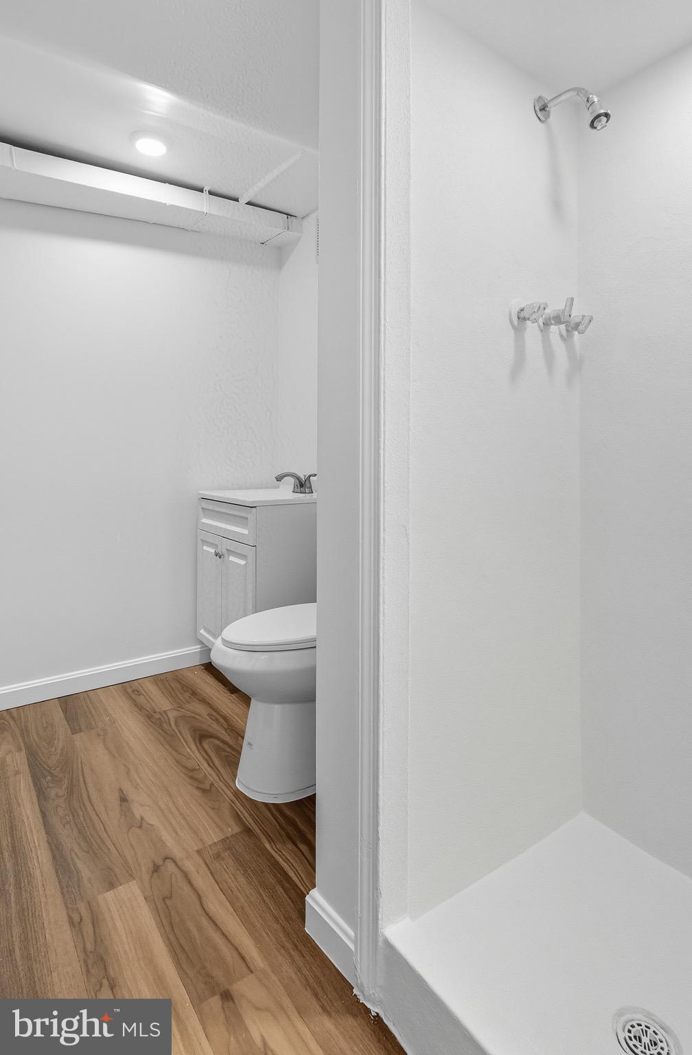 604 East 33rd Street Baltimore, MD 21218 - Photo 20 of 22 a bathroom with a toilet and a shower