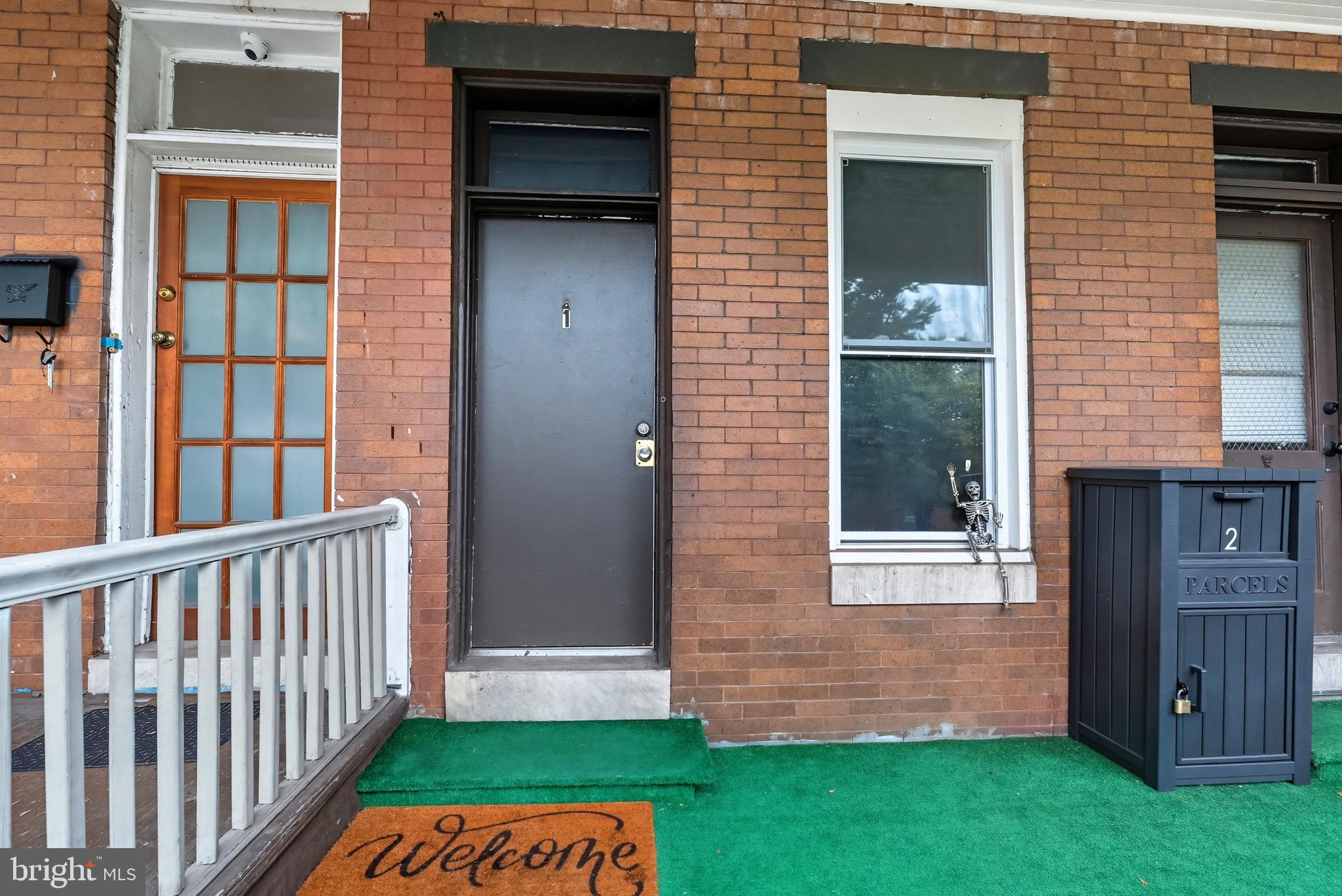 604 East 33rd Street Baltimore, MD 21218 - Photo 2 of 22 a view of front door of a house with a yard