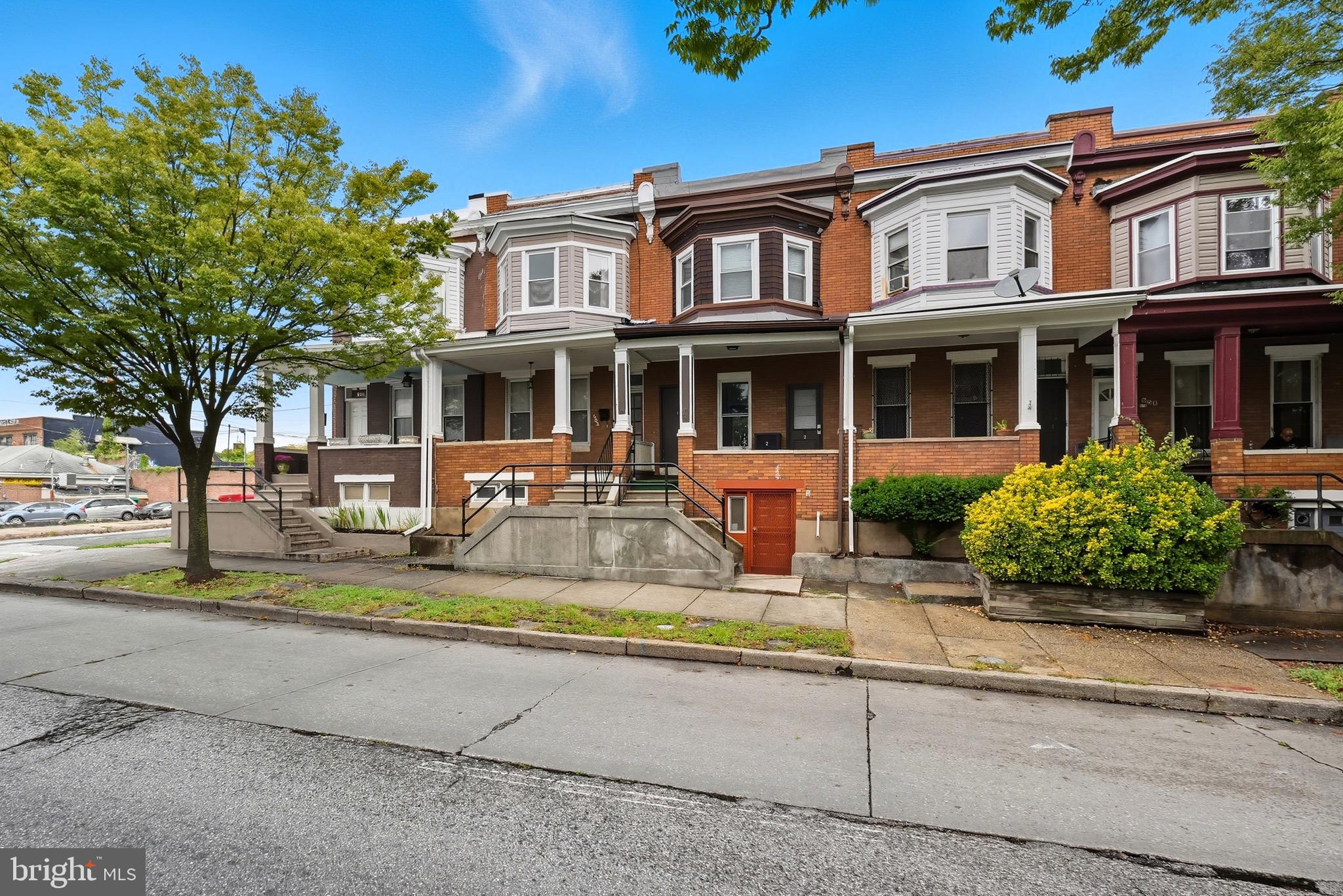 604 East 33rd Street Baltimore, MD 21218 - Photo 3 of 22 front view of house with a yard