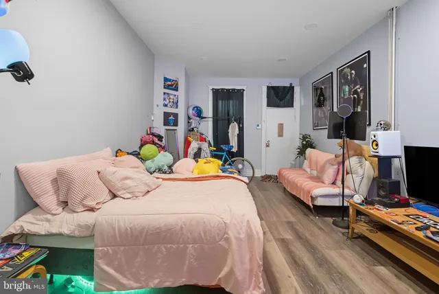 a bedroom with bed and a couch