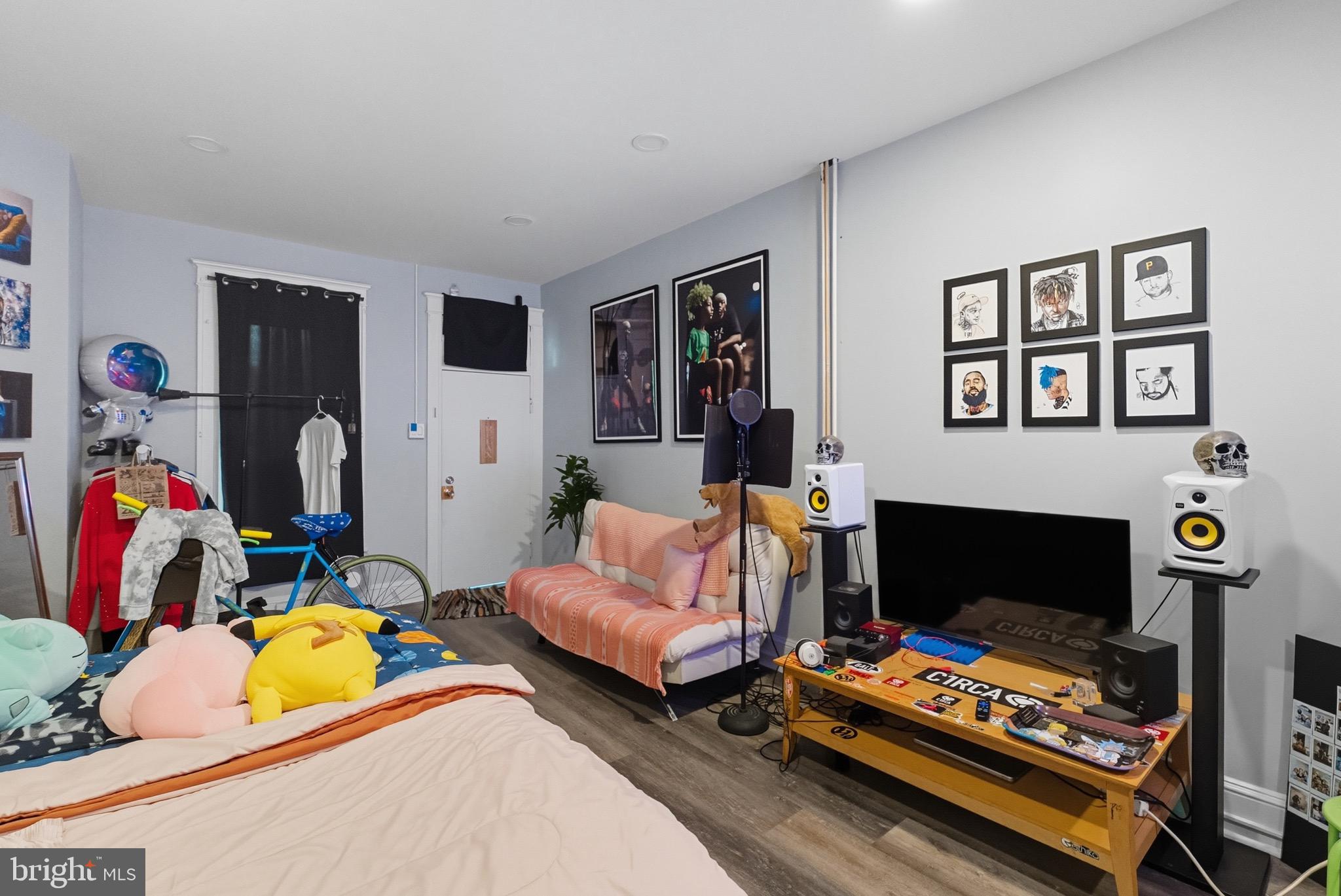 604 East 33rd Street Baltimore, MD 21218 - Photo 7 of 22 a living room with furniture and a fireplace
