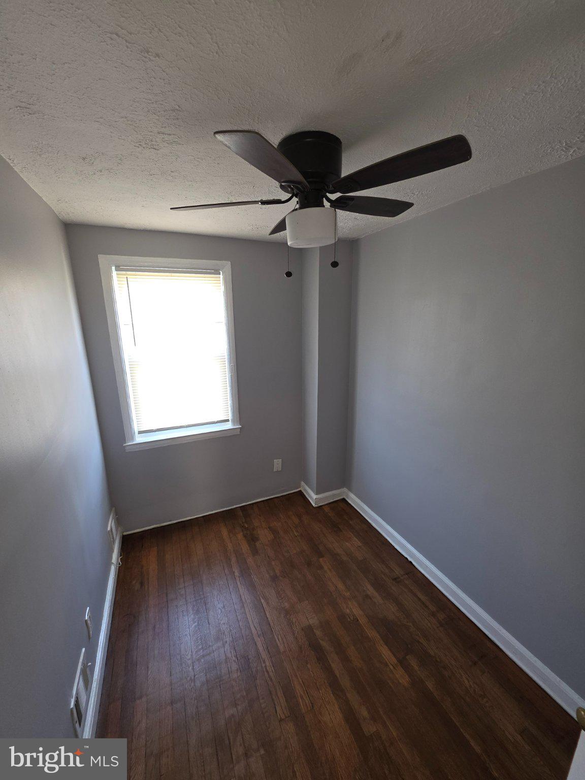 4404 Mountview Road Baltimore, MD 21229 - Photo 13 of 22 wooden floor in an empty room with a window