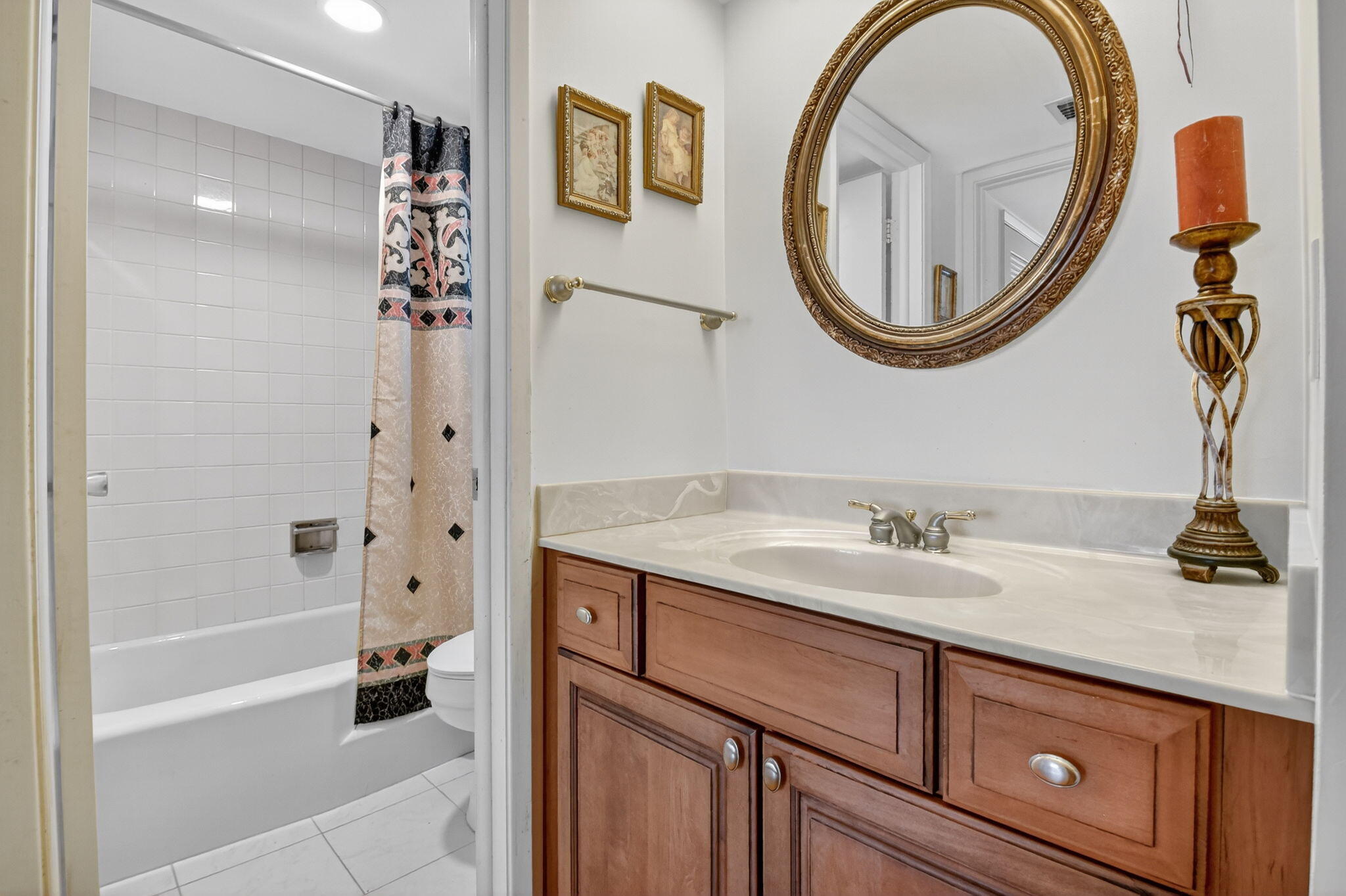 3570 South Ocean Boulevard, Unit 508 South Palm Beach, FL 33480 - Photo 19 of 47 a bathroom with a granite countertop sink a mirror and a shower