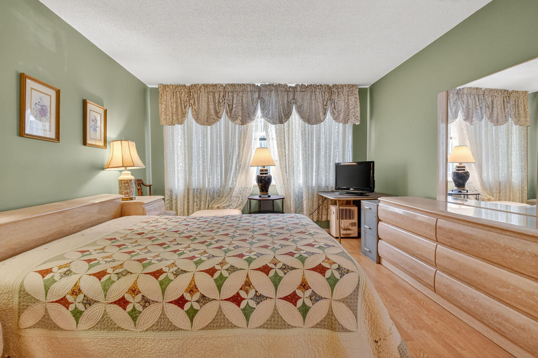 3570 South Ocean Boulevard, Unit 508 South Palm Beach, FL 33480 - Photo 21 of 47 a bedroom with a bed and a television