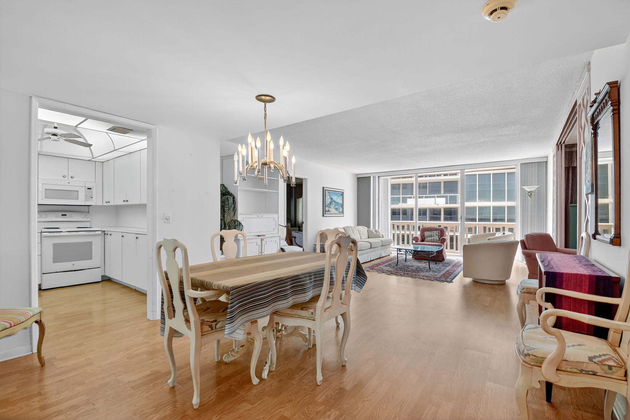 3570 South Ocean Boulevard, Unit 508 South Palm Beach, FL 33480 - Photo 6 of 47 a view of a dining room with furniture window and wooden floor