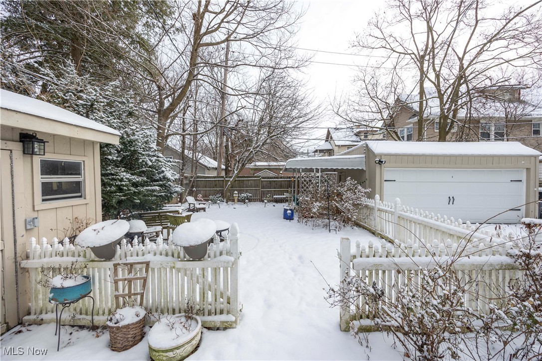 2075 Coventry Road Cleveland, OH 44118 - Photo 34 of 41 Yard layered in snow featuring a garage and an outdoor structure
