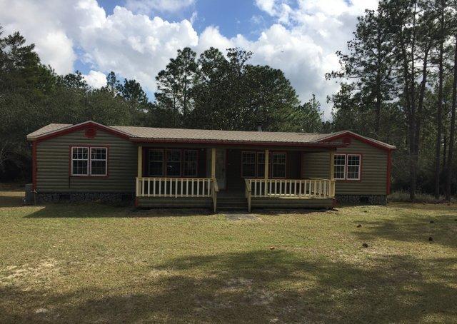 350 Robbins Road DeFuniak Springs, FL 32433 - Photo 1 of 13 a view of a house with a yard