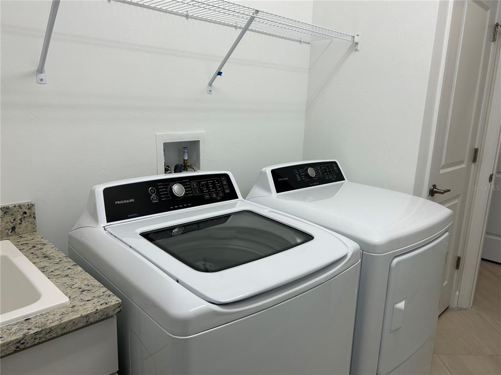15513 White Linen Drive Lakewood Ranch, FL 34211 - Photo 21 of 35 a utility room with dryer and washer