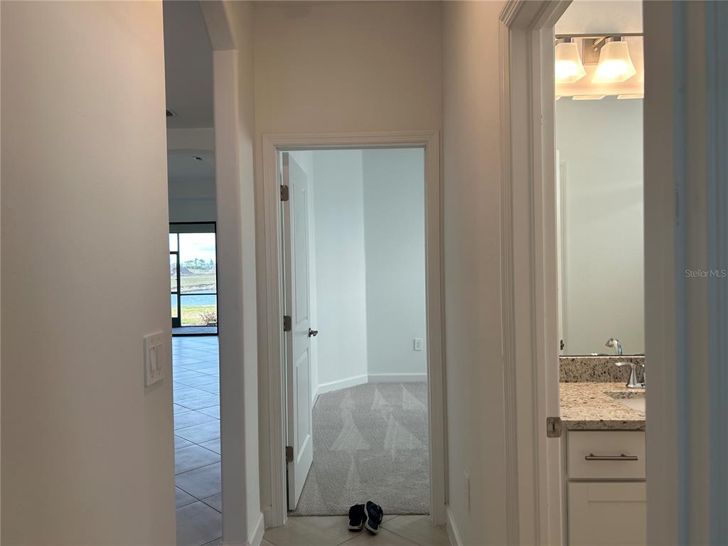 15513 White Linen Drive Lakewood Ranch, FL 34211 - Photo 24 of 35 a view of a bathroom from a hallway