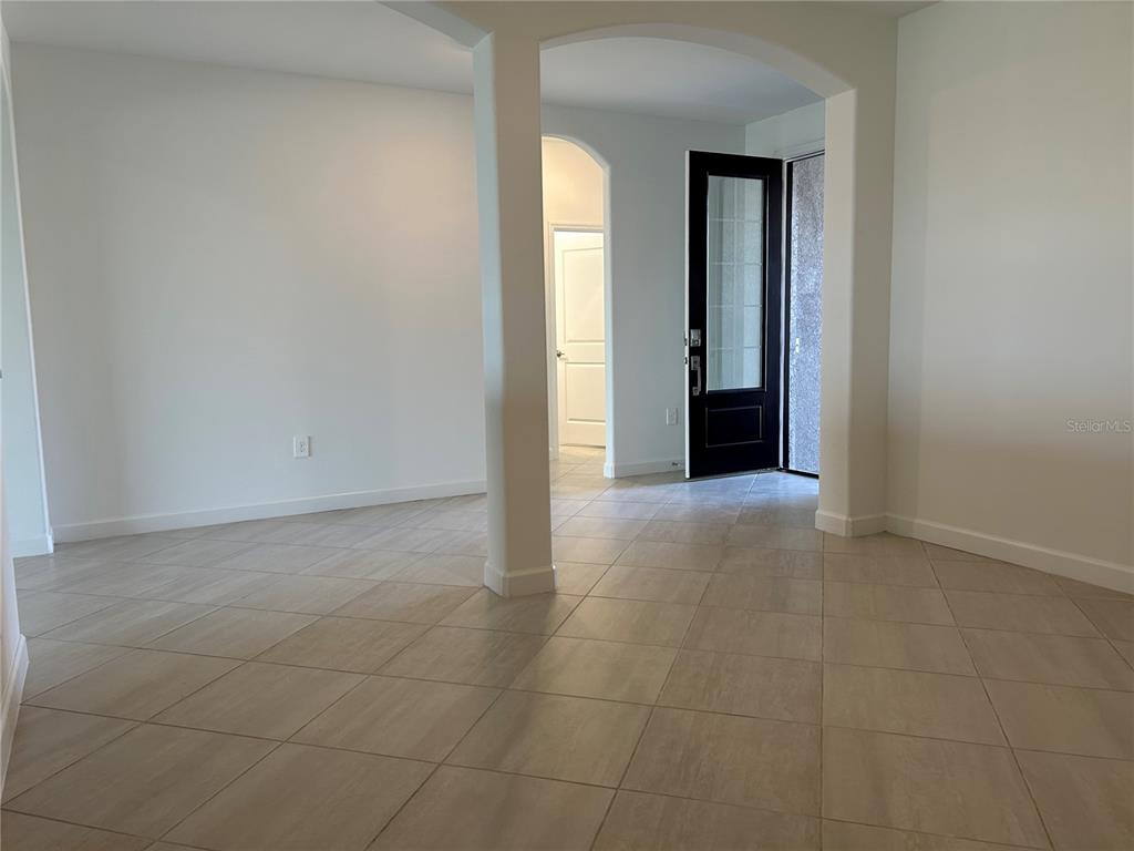 15513 White Linen Drive Lakewood Ranch, FL 34211 - Photo 4 of 35 an empty room with window and bathroom