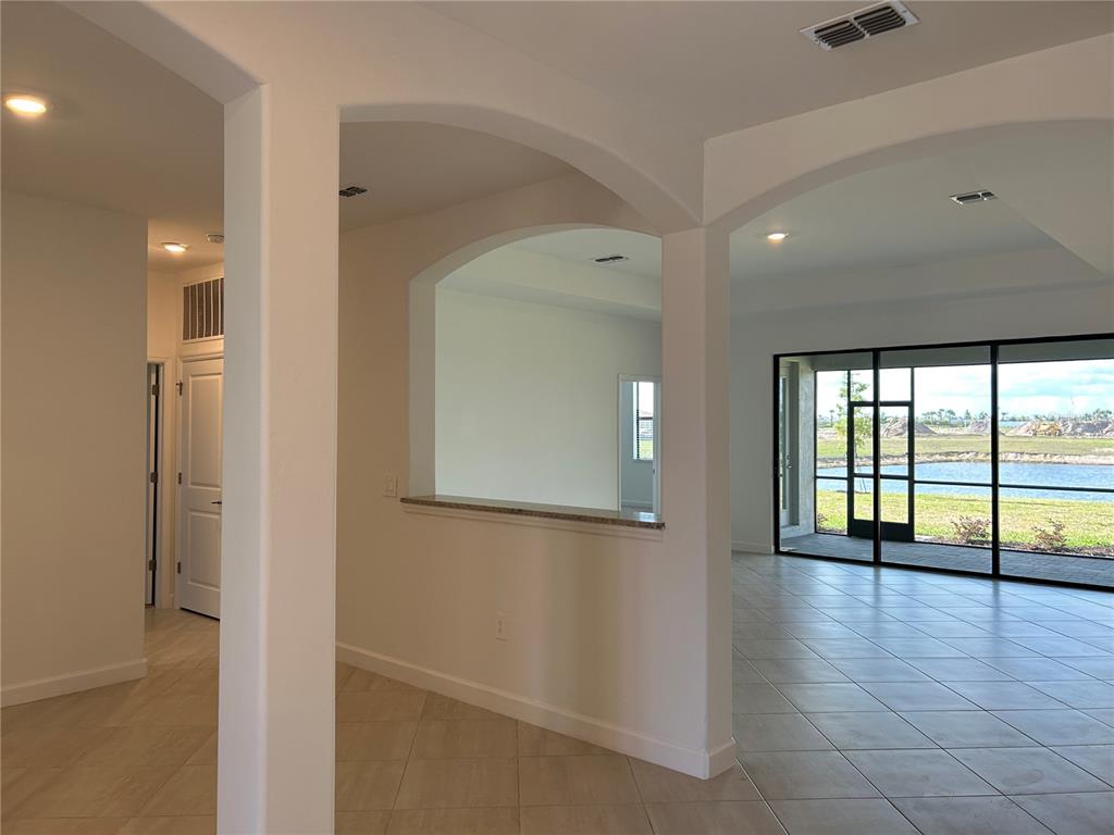 15513 White Linen Drive Lakewood Ranch, FL 34211 - Photo 5 of 35 a view of an entryway with wooden floor