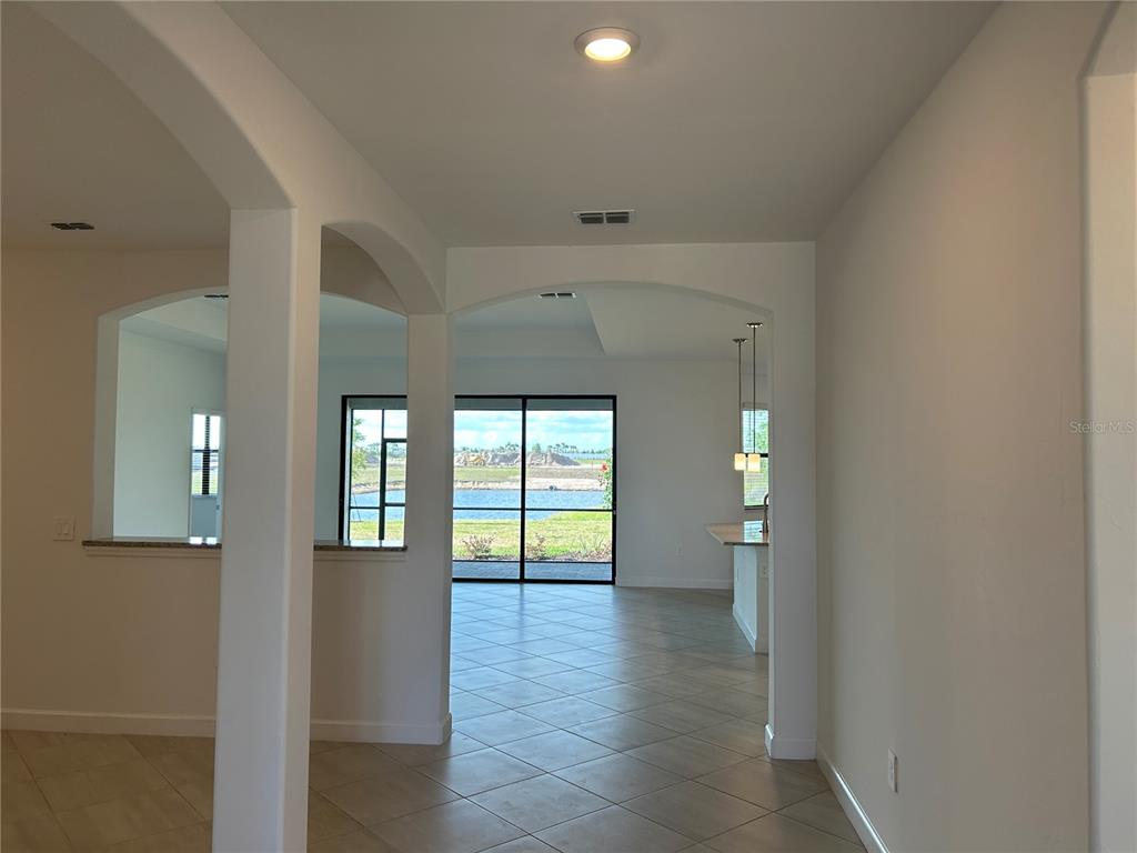 15513 White Linen Drive Lakewood Ranch, FL 34211 - Photo 6 of 35 a view of an entryway of a house and wooden floor