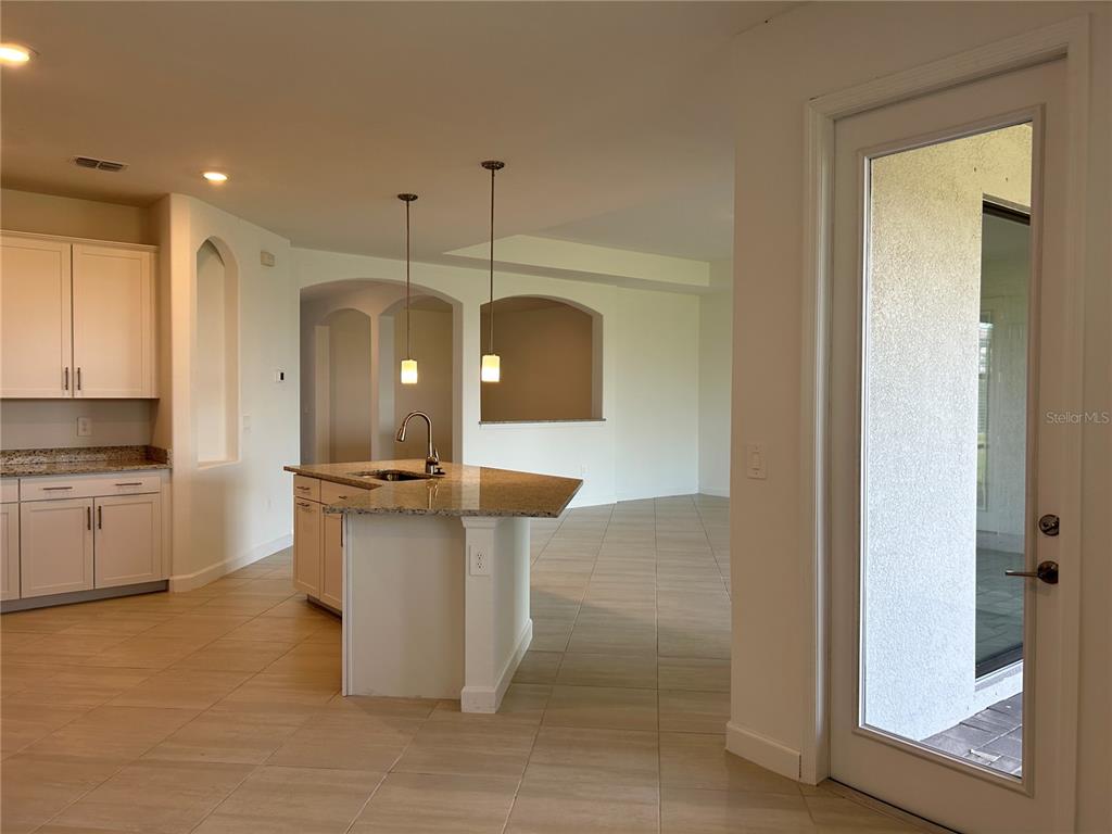 15513 White Linen Drive Lakewood Ranch, FL 34211 - Photo 9 of 35 a kitchen with a sink and refrigerator