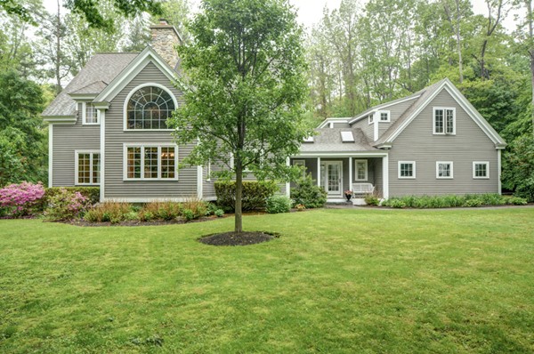 53 Porter Road Andover, MA 01810 - Photo 1 of 17 a front view of a house with a garden