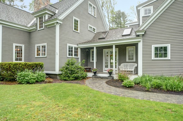 53 Porter Road Andover, MA 01810 - Photo 2 of 17 a view of a house with a yard and plants