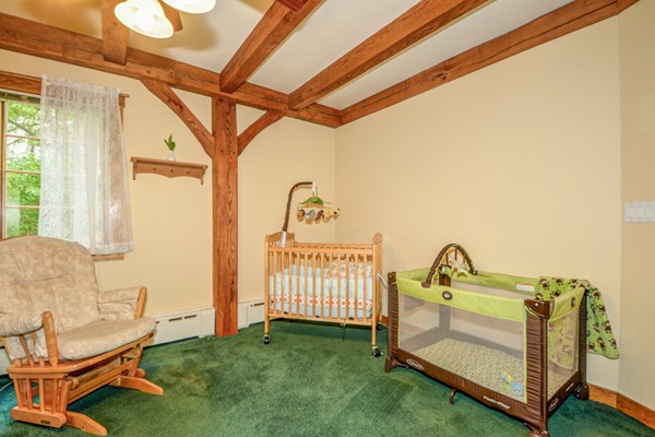 53 Porter Road Andover, MA 01810 - Photo 10 of 17 a view of a bedroom with furniture and windows