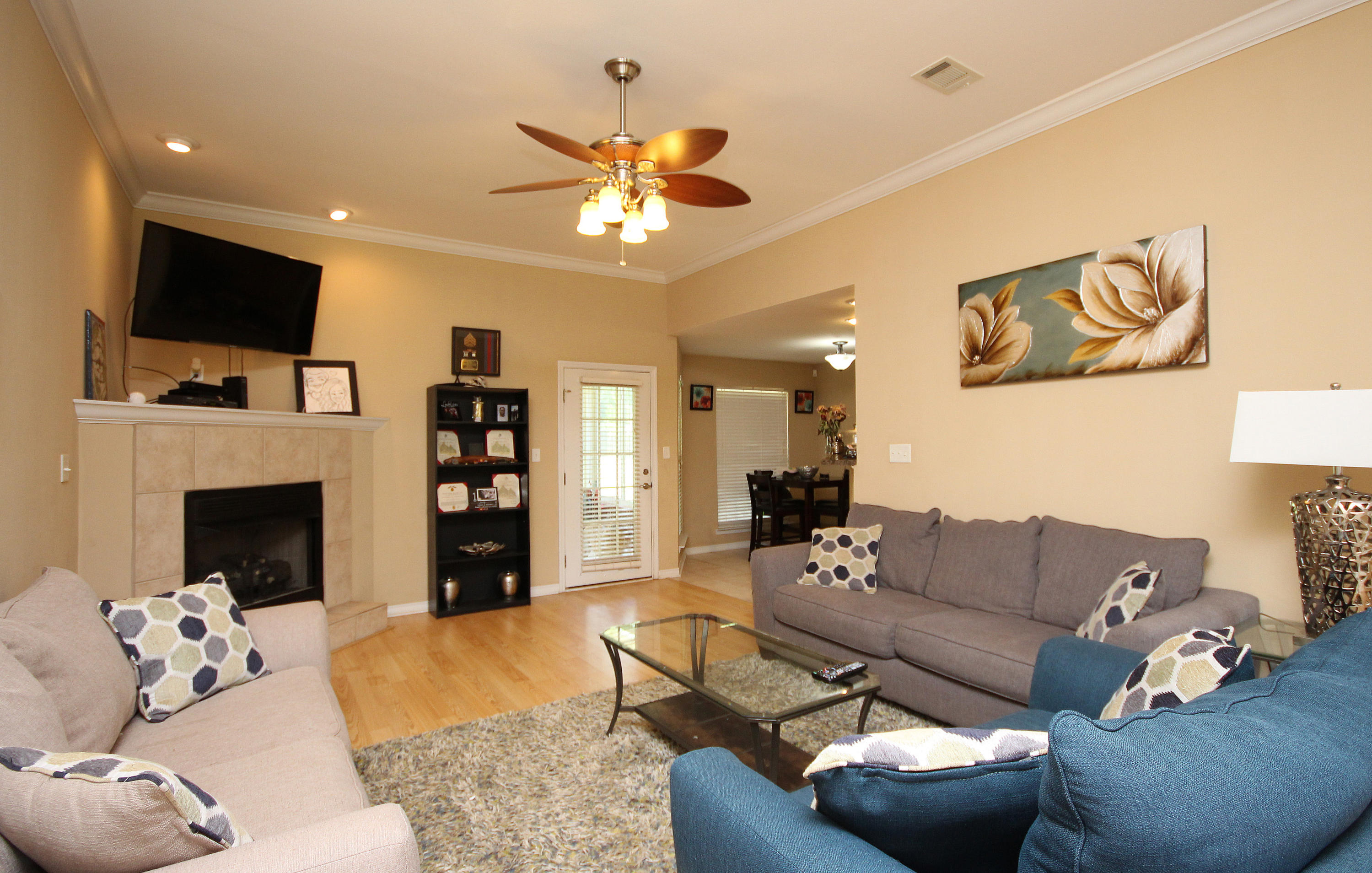 5819 Roberts Road Crestview, FL 32536 - Photo 13 of 36 a living room with furniture a fireplace and a flat screen tv