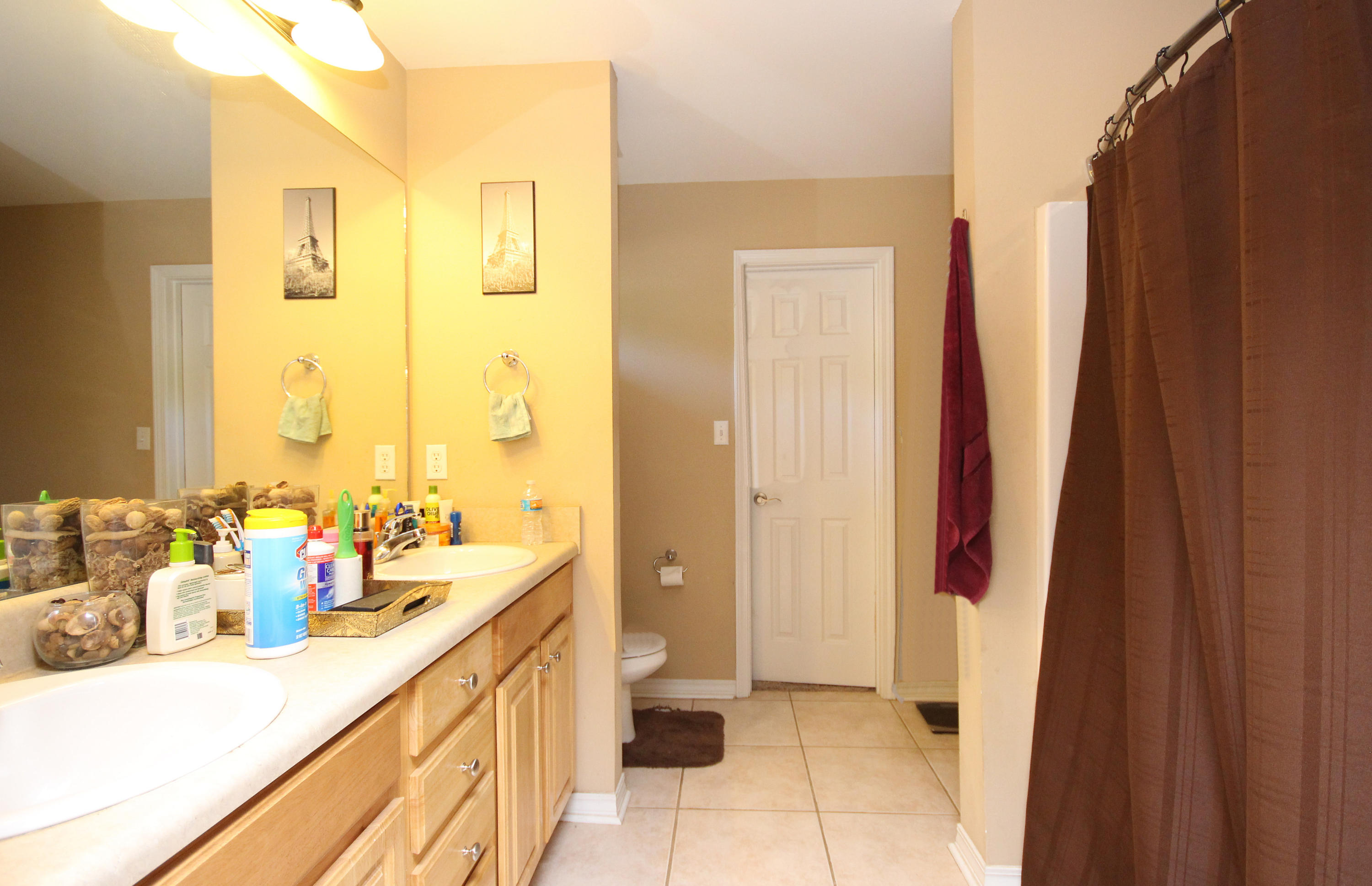 5819 Roberts Road Crestview, FL 32536 - Photo 17 of 36 a bathroom with sink a double vanity and a mirror