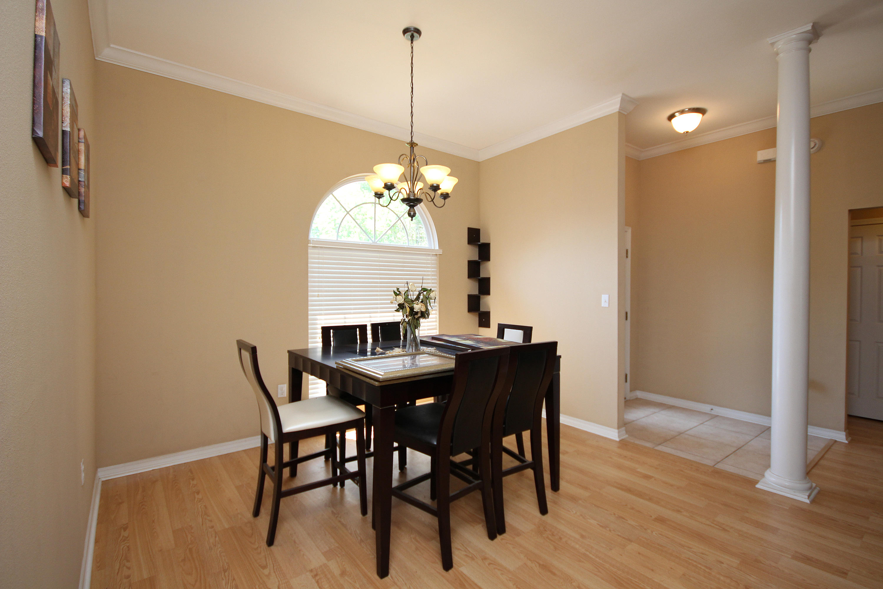 5819 Roberts Road Crestview, FL 32536 - Photo 18 of 36 a view of a dining room with furniture window and wooden floor