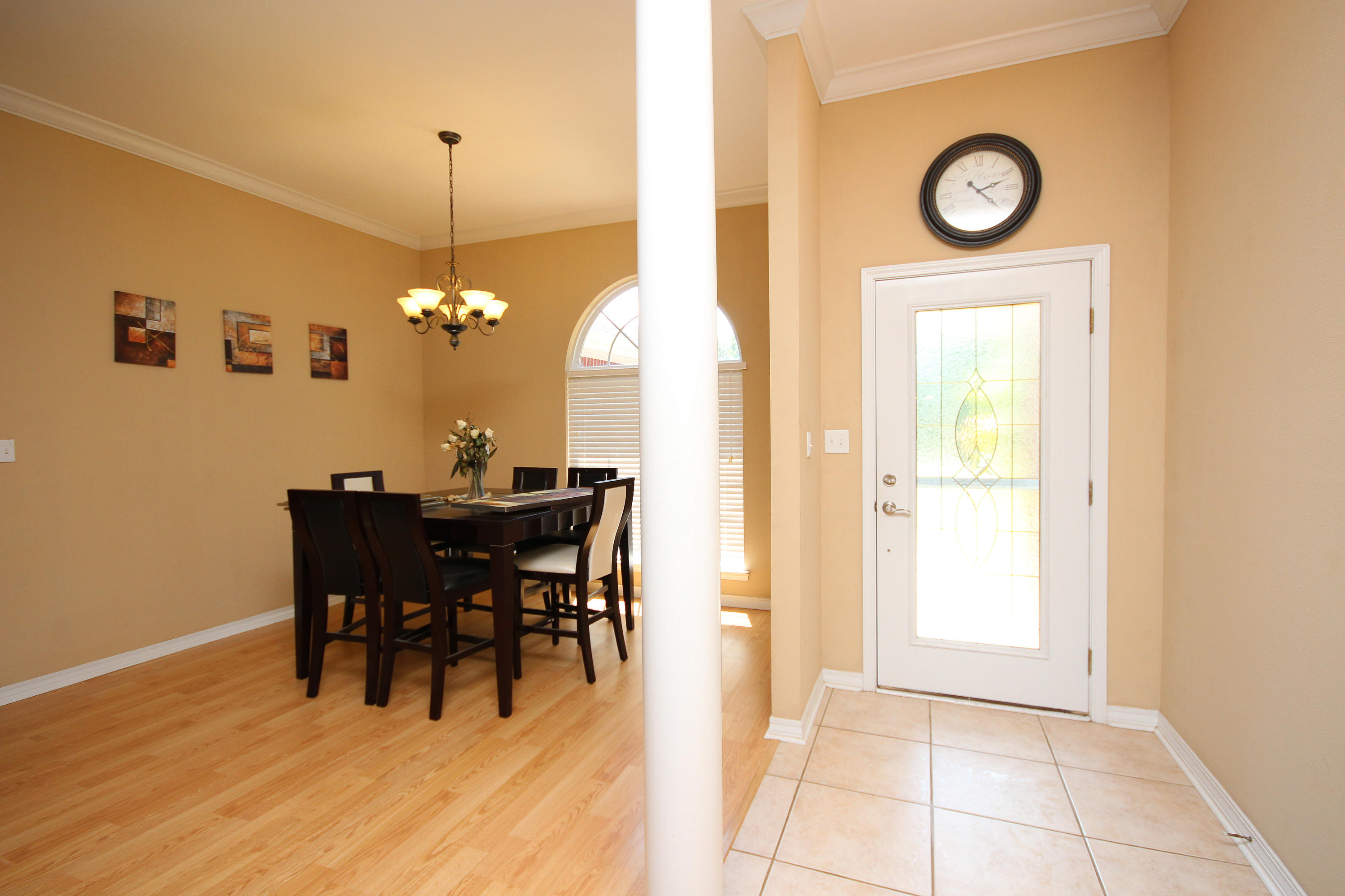 5819 Roberts Road Crestview, FL 32536 - Photo 19 of 36 a view of a dining room with furniture and a chandelier