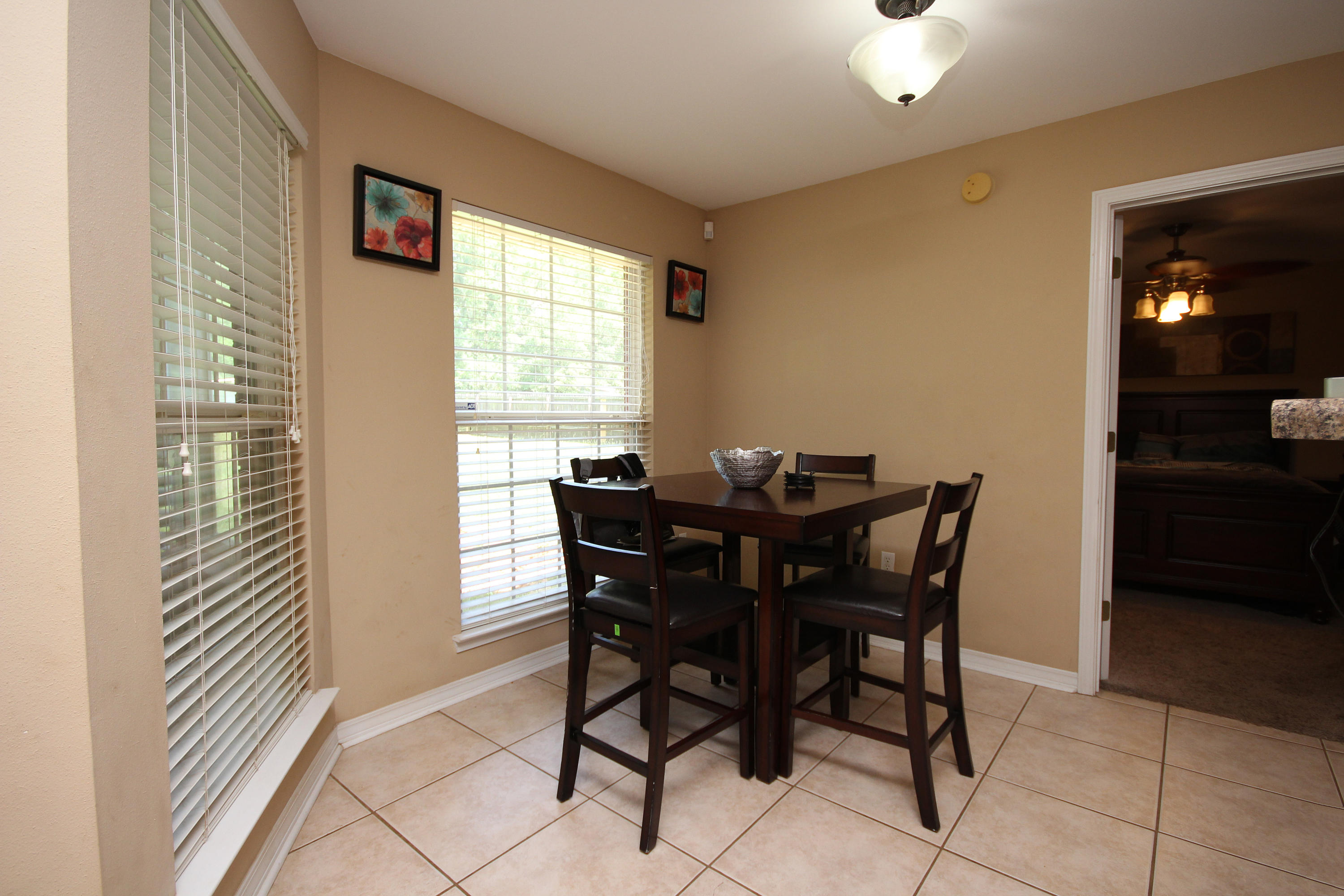 5819 Roberts Road Crestview, FL 32536 - Photo 22 of 36 a view of a dining room with furniture and chandelier